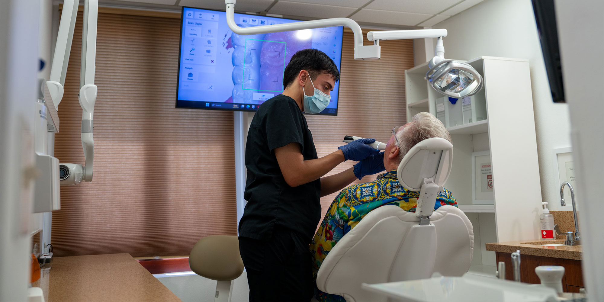 dentist is getting 3d scan of patients teeth for oral surgery